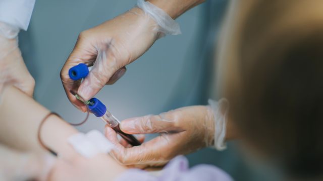 A close up of someone taking blood.